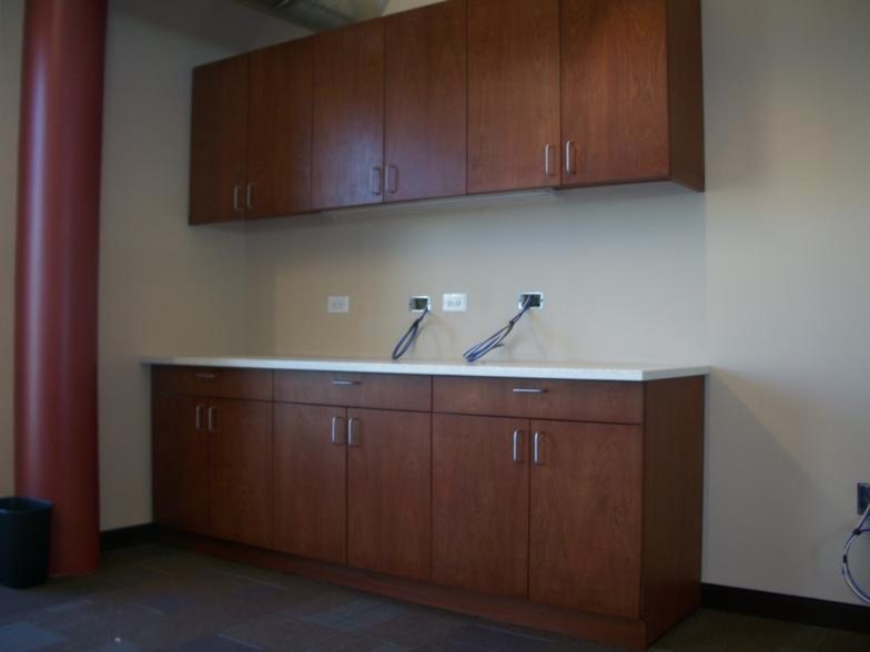 Wall cabinets and base cabinets with solid surface countertop